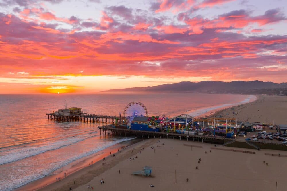 Group arriving at Santa Monica Pier on a luxury charter bus for a Los Angeles city tour