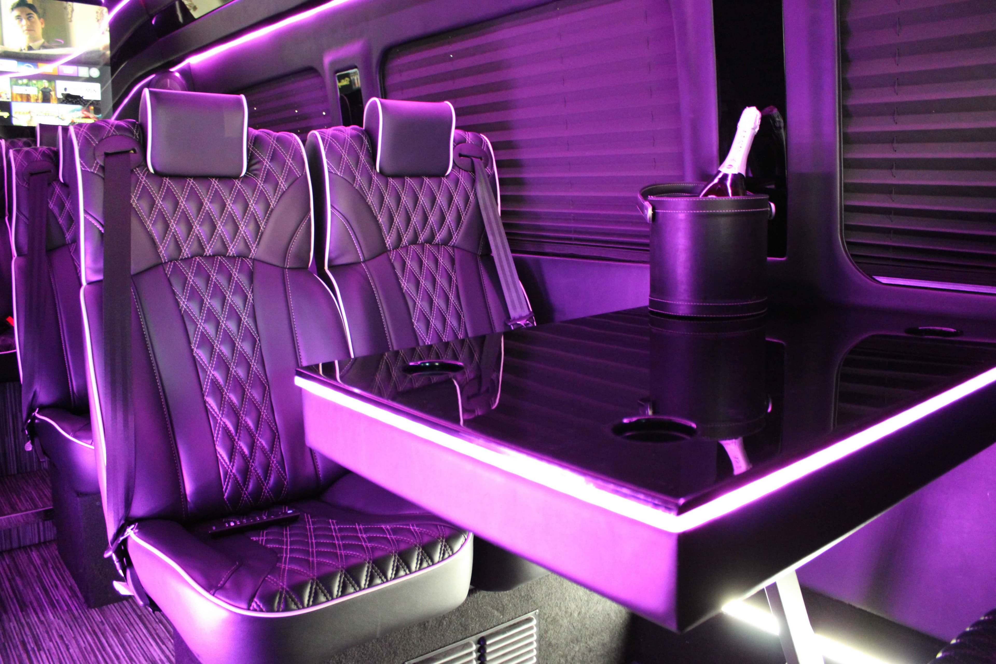 Executive team boarding a luxury Sprinter for a private corporate transfer
